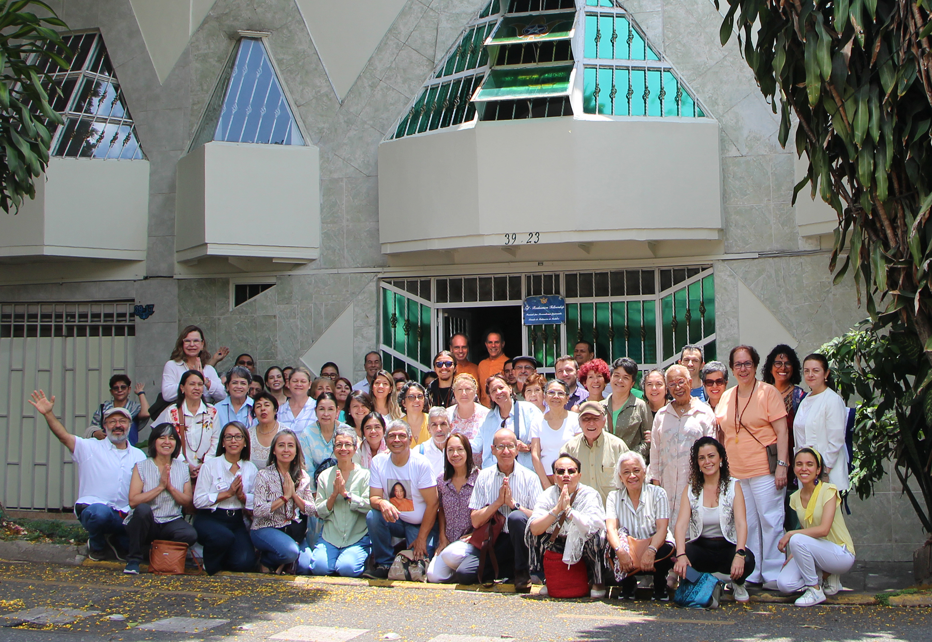 The monks then traveled to Medellín, Colombia, and are shown here with devotees in front of their meeting place.