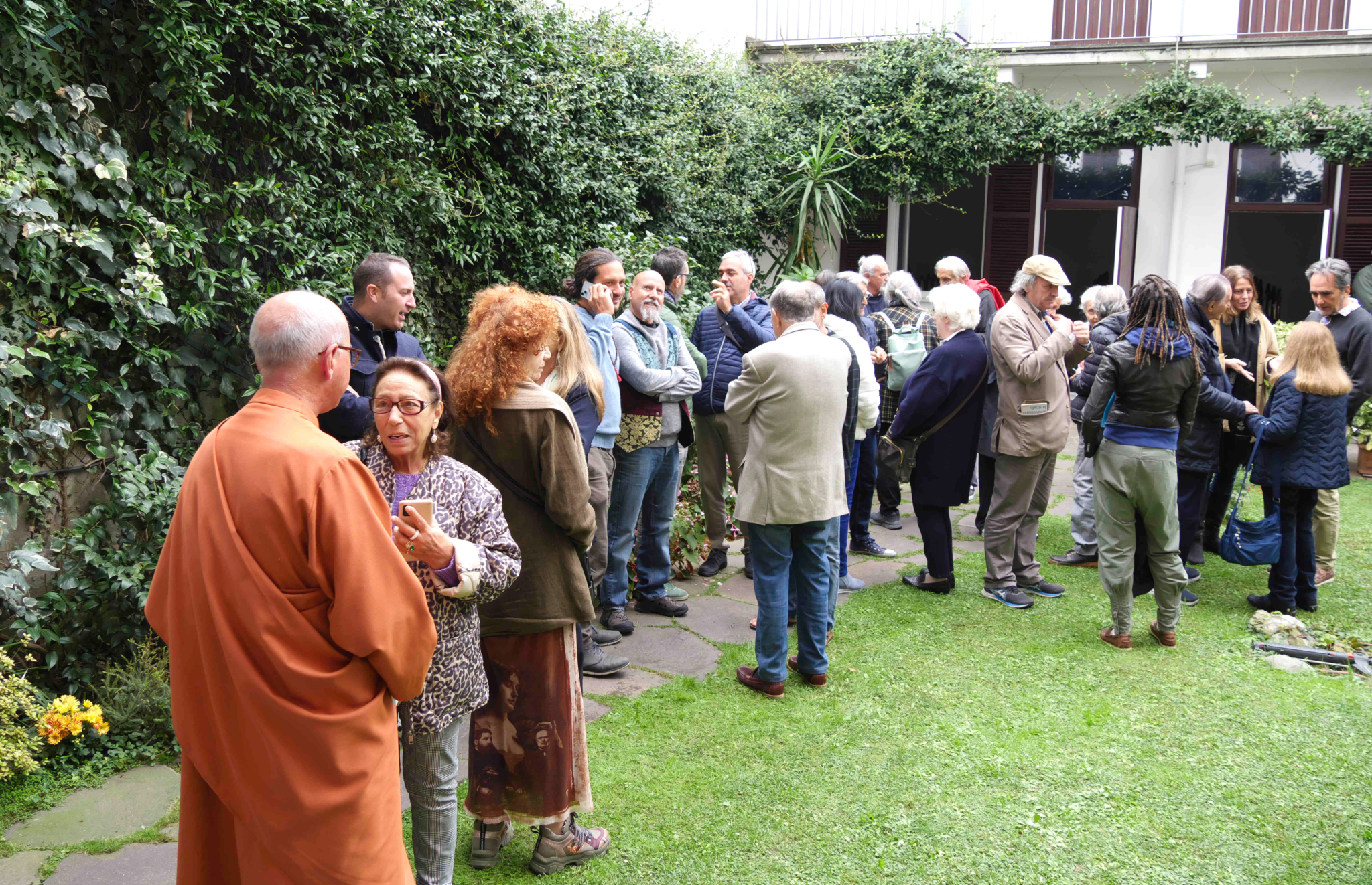 Milano members greet Brother Vidyananda.