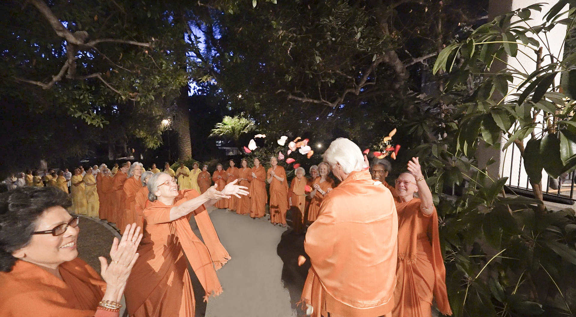 SRF nuns honor Brother Chidananda's departure from the Mother Center.