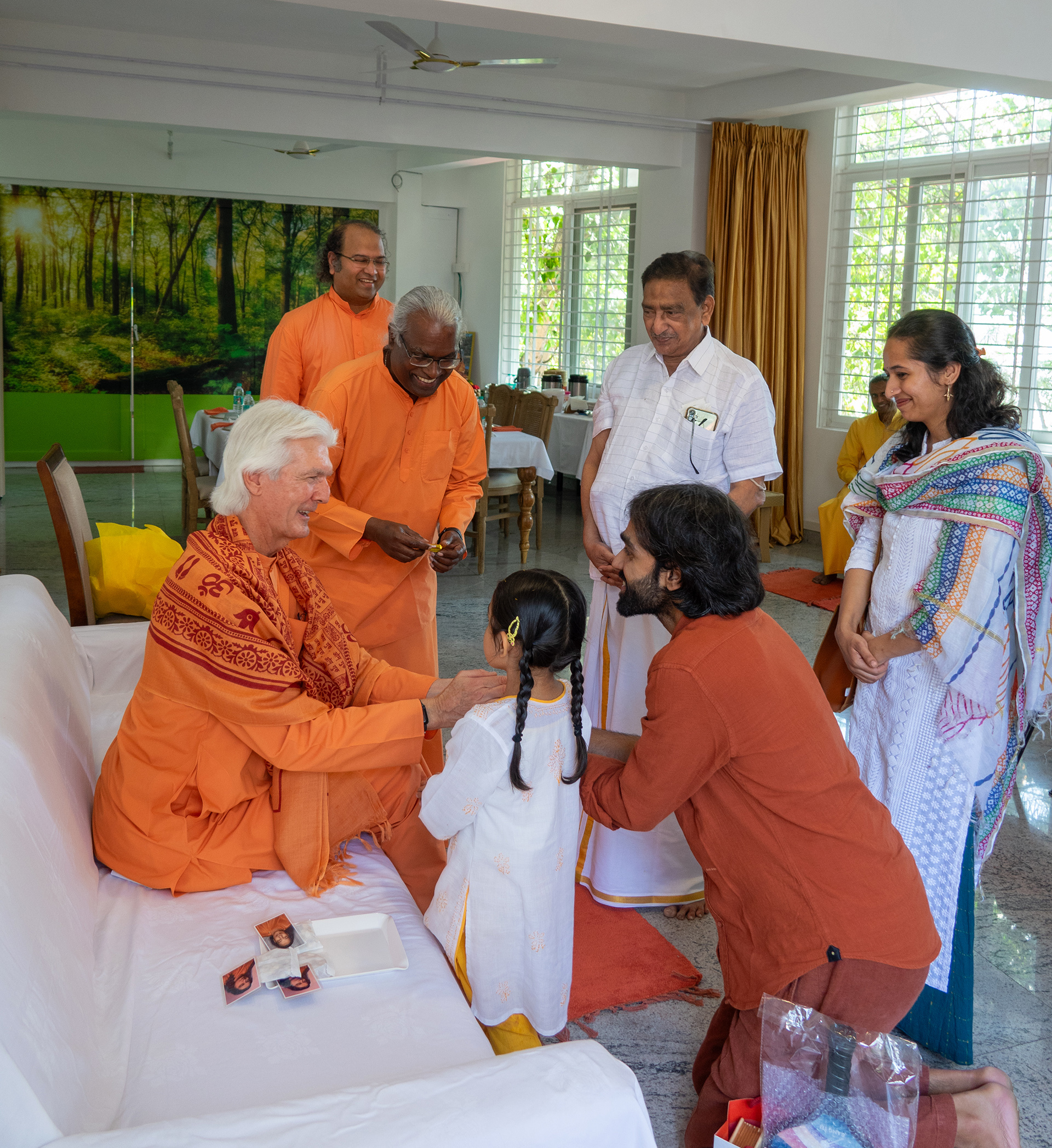 After the program, Brother Chidananda greeted devotees, distributing prasad and blessing each of them.