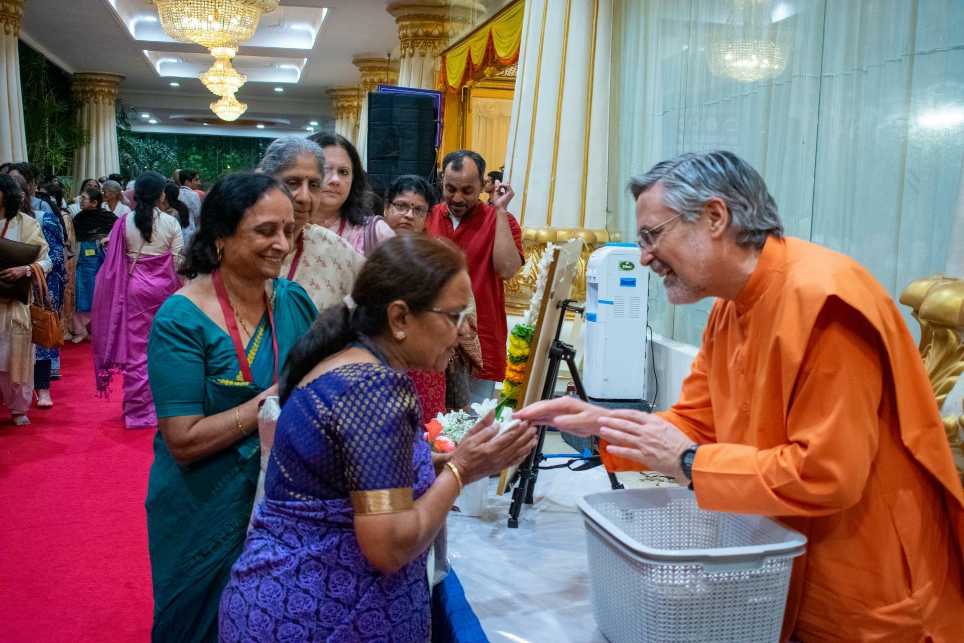 Brother Saralananda gave prasad to devotees at the conclusion of the program.