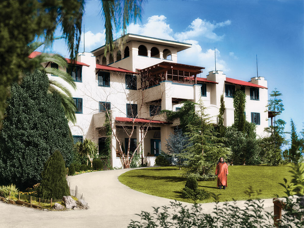 Paramahansa Yogananda standing in front of Mother Center