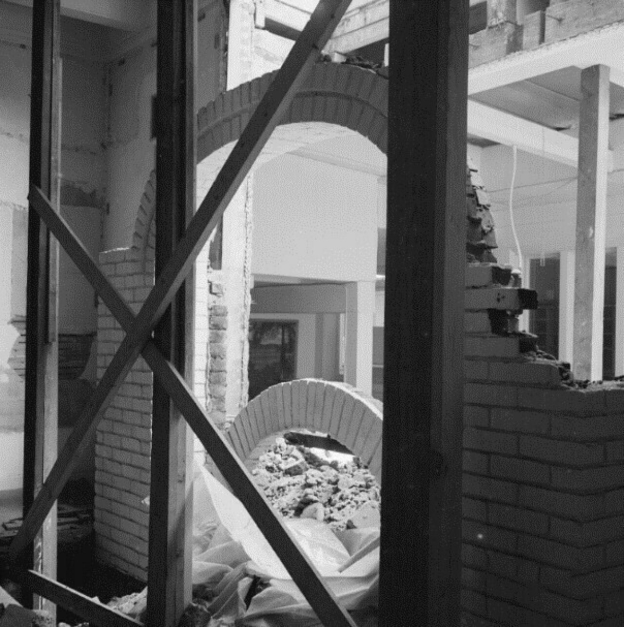 Collapsed chimney and fireplace in IHQ Main Hall